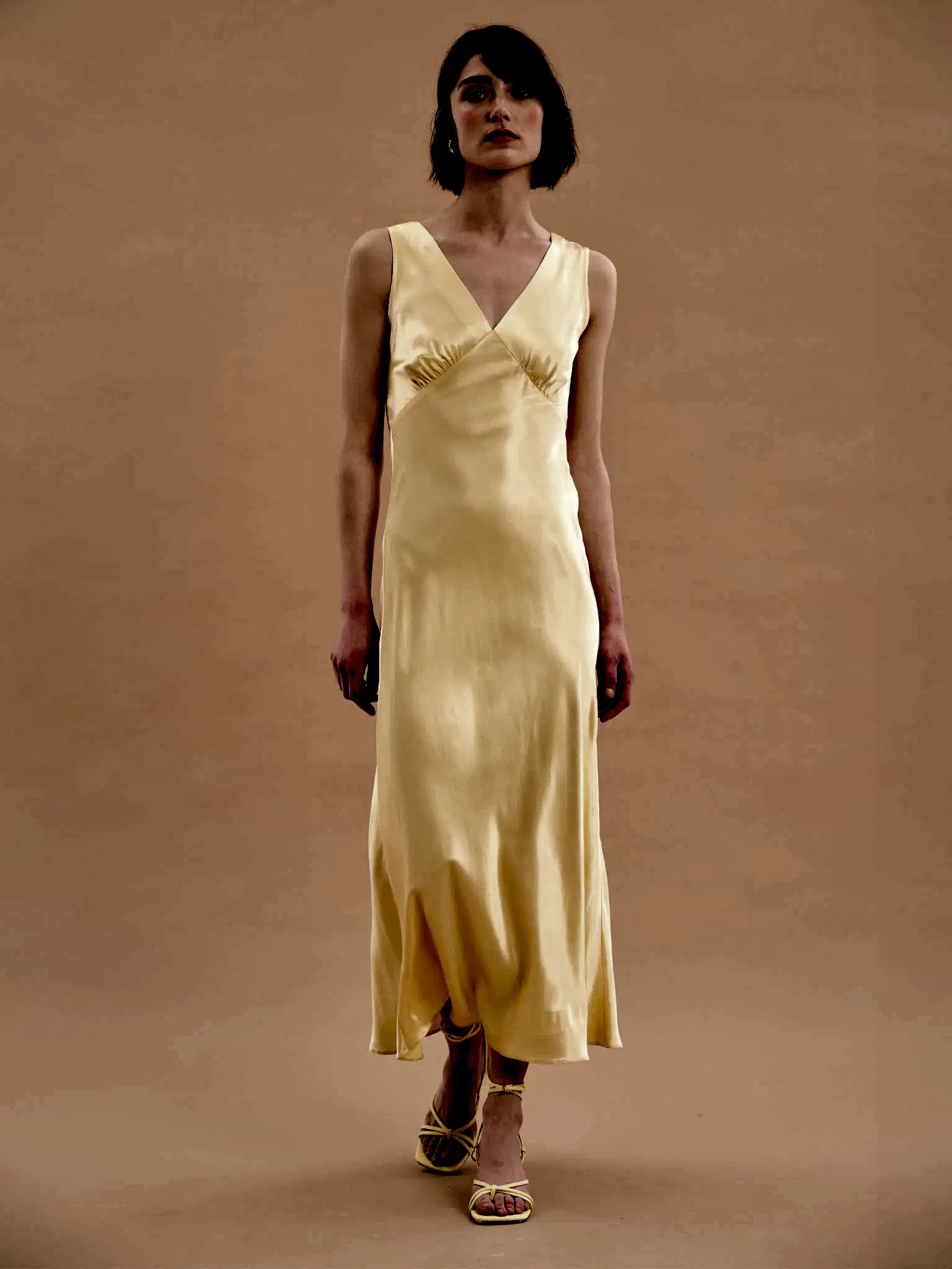 yellow satin maxi dress with v neck and ruching detail